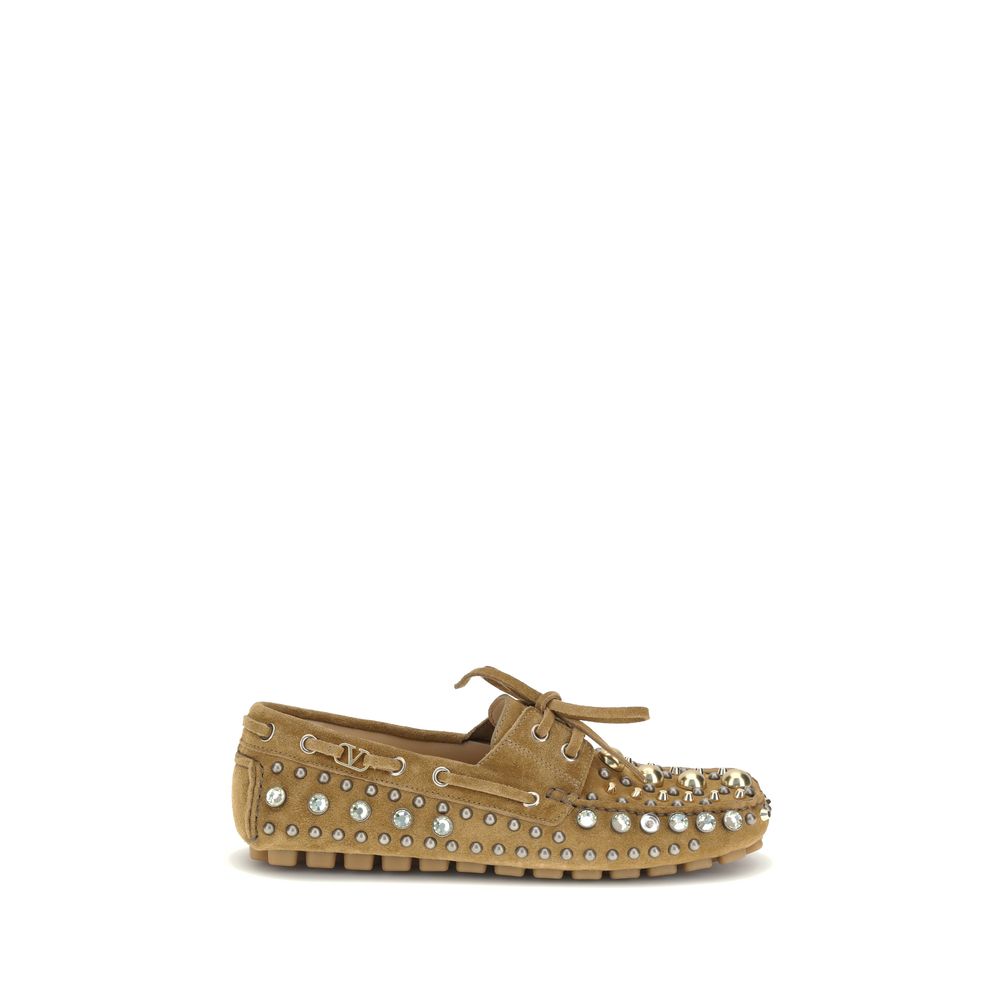 Valentino Garavani Beige Calf Leather Bos Taurus Slip-On Loafers with studs and rhinestones, featuring a durable leather sole.