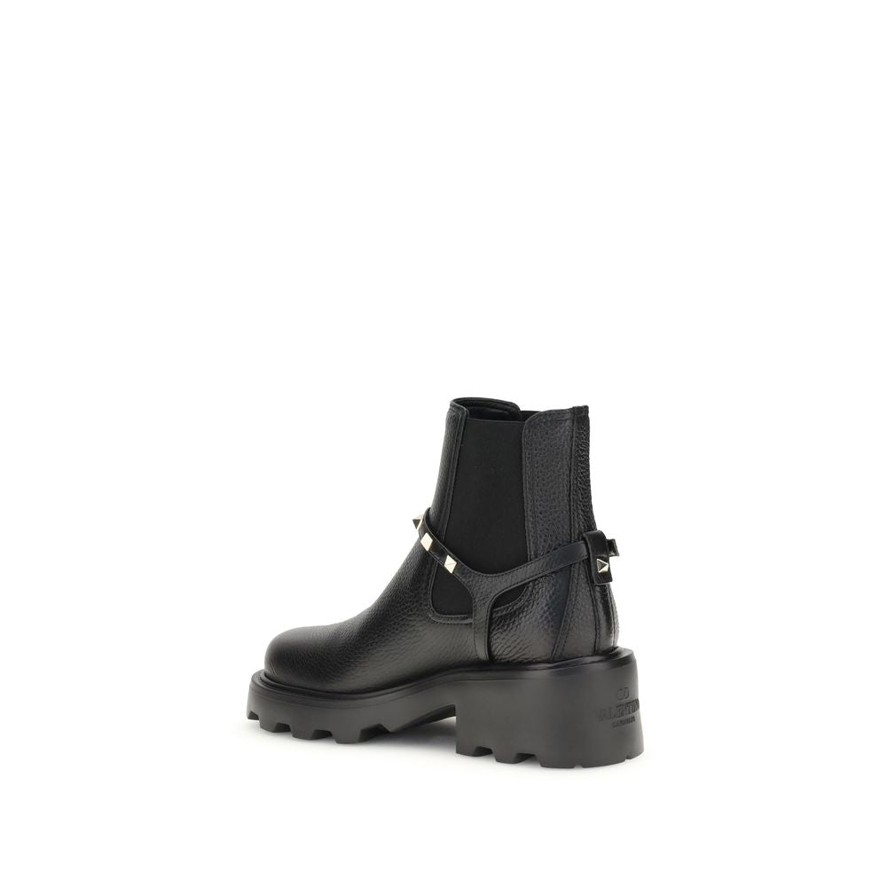 Valentino Garavani Black Calf Leather Bos Taurus Ankle Boots with metal studs and side elastic inserts, AW25 collection.