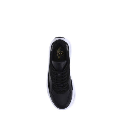 Top view of Valentino Garavani Black Calf Leather Bos Taurus Chunky Sneakers showing lace-up design and embossed logo on tongue.