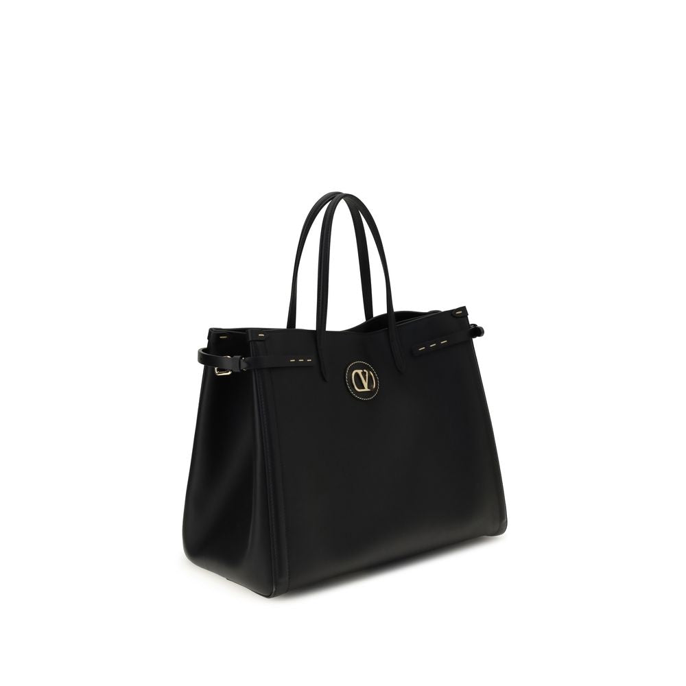 Valentino Garavani Black Calf Leather Bos Taurus Handbag with metallic logo and protective feet