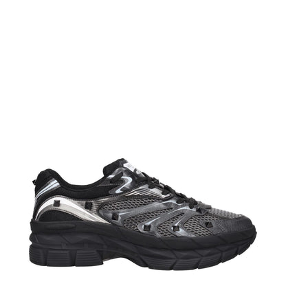 Valentino Garavani Black Fabric Athletic Sneakers with studs, front and back logo, lace-up closure, rubber sole, and mid heels.