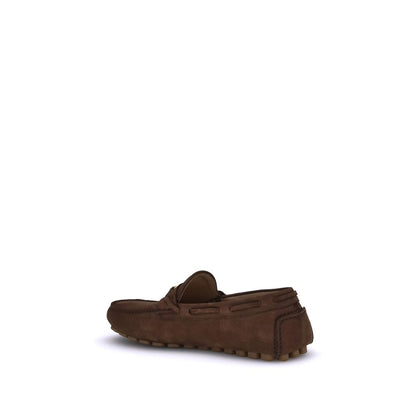 Back view of Valentino Garavani Brown Rubber Slip-On Loafers with notched sole and VLogo plaque.
