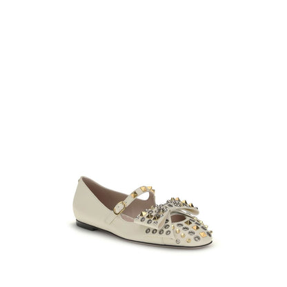 Valentino Garavani Cream Goatskin Ballet Flats with studded design and bow accent, featuring adjustable buckle strap and VLogo detail.