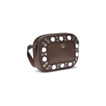 Valentino Garavani Nellcôte Shoulder Bag in garnet calfskin with ball studs, rivets, and palladium finish metal details.