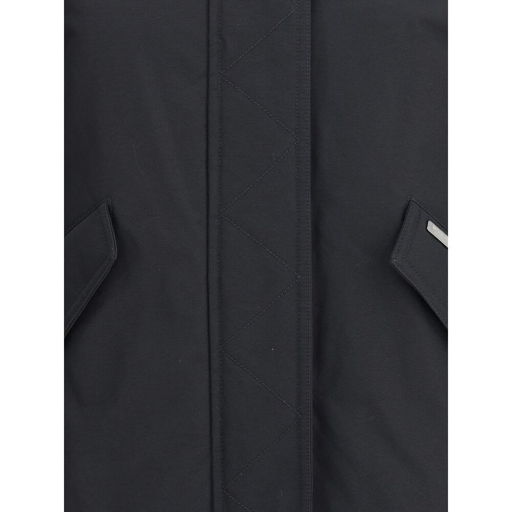 Close-up of Woolrich Black Cotton Shell Jacket front with zipper and pockets, showcasing quality design details and materials.