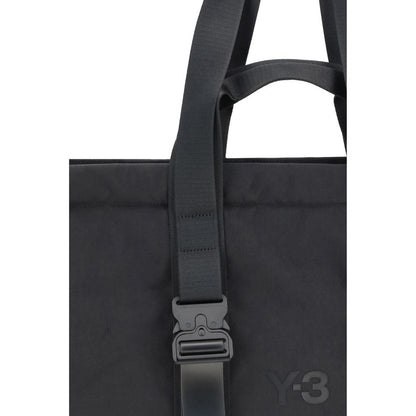 Y-3 Black Nylon Shoulder Bag with top handles and zip closure, featuring tone-on-tone logo, perfect for organized and secure storage.