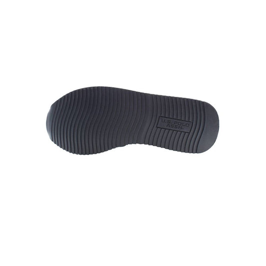 U.S. POLO ASSN. sneaker sole with logo, black rubber outsole, textured for grip, showcasing durable craftsmanship and brand quality.